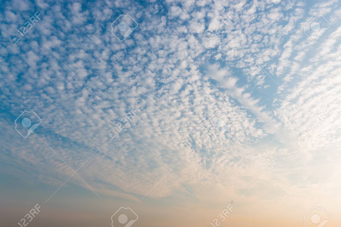 Sunset Sky With White Clouds And Bright Sky Blue Background Stock