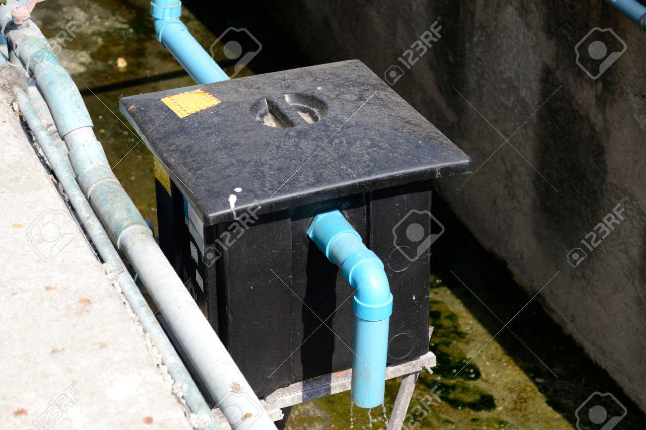 Outdoor grease trap tank, outside a restaurant - 37508416 Outdoor grease trap tank, outside a restaurant - 37508416
