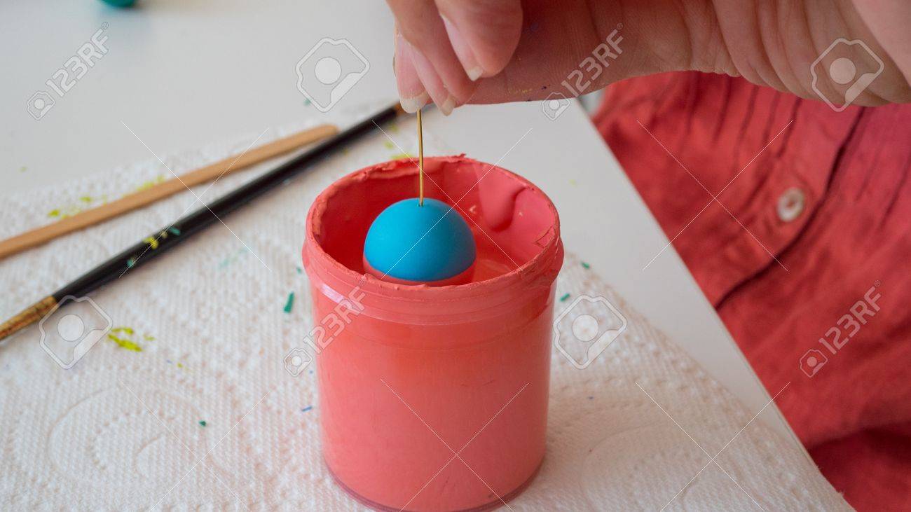 female hands painting polymer clay. Handmade workshop composition of clay, beads, tools and paint - 80844895 female hands painting polymer clay. Handmade workshop composition of clay, beads, tools and paint - 80844895