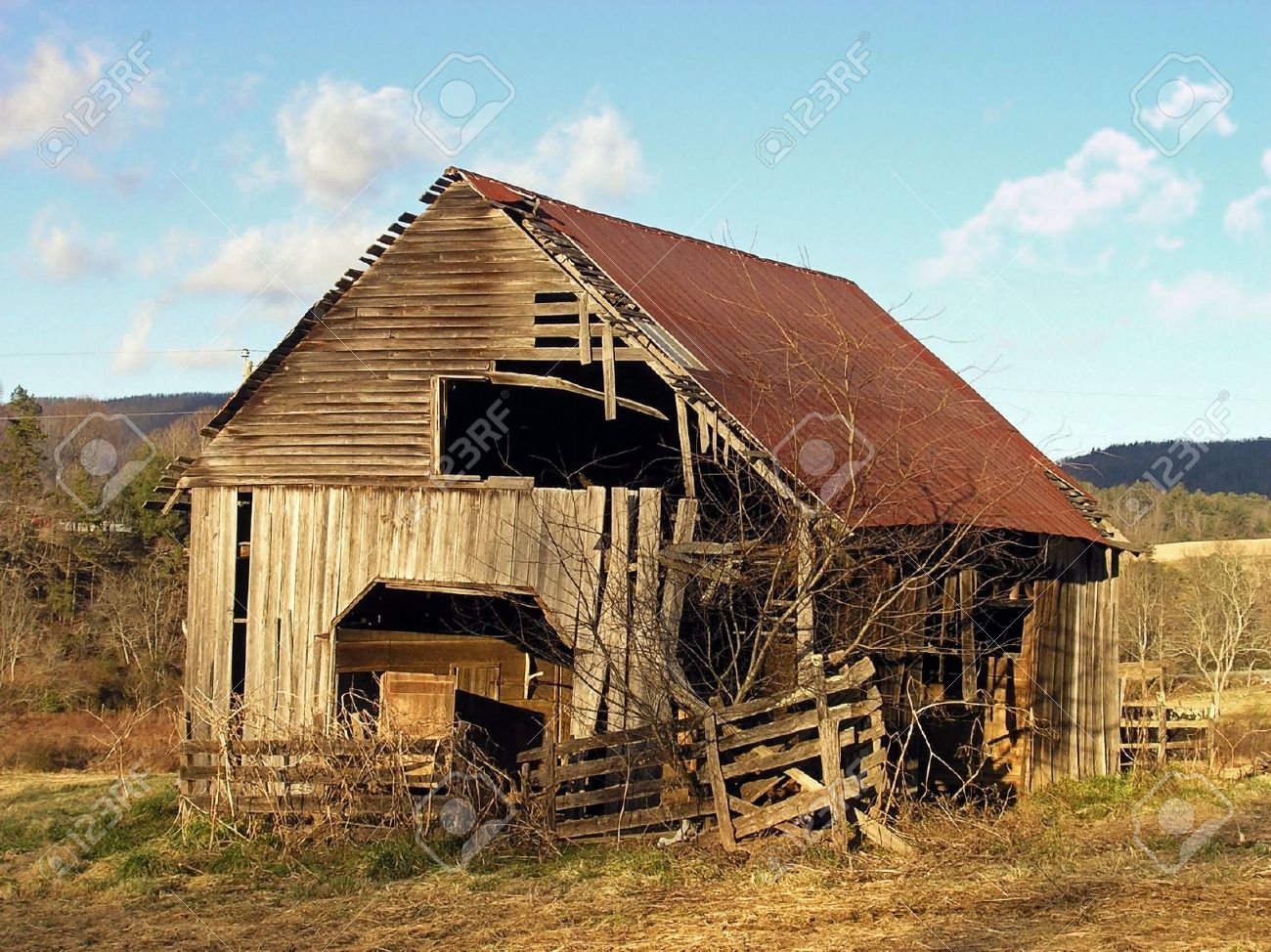 a old barn in a late winter evening stock photo picture and