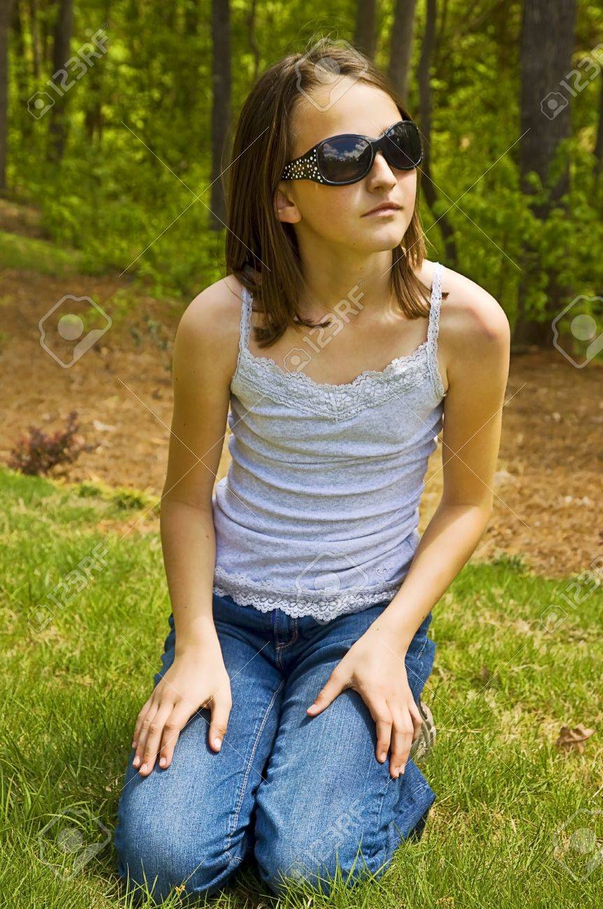 A Cute Young Girl Outside With Stylish Sunglasses, She Has A Thoughtful  Expression. Stock Photo, Picture and Royalty Free Image. Image 9379378.