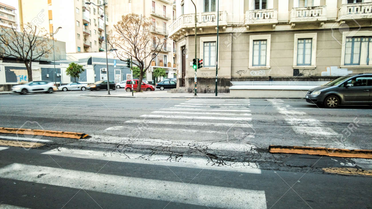 A typical road crossing for pedestrians in the center of Catania City, in Sicily, Italy. - 166119178 A typical road crossing for pedestrians in the center of Catania City, in Sicily, Italy. - 166119178