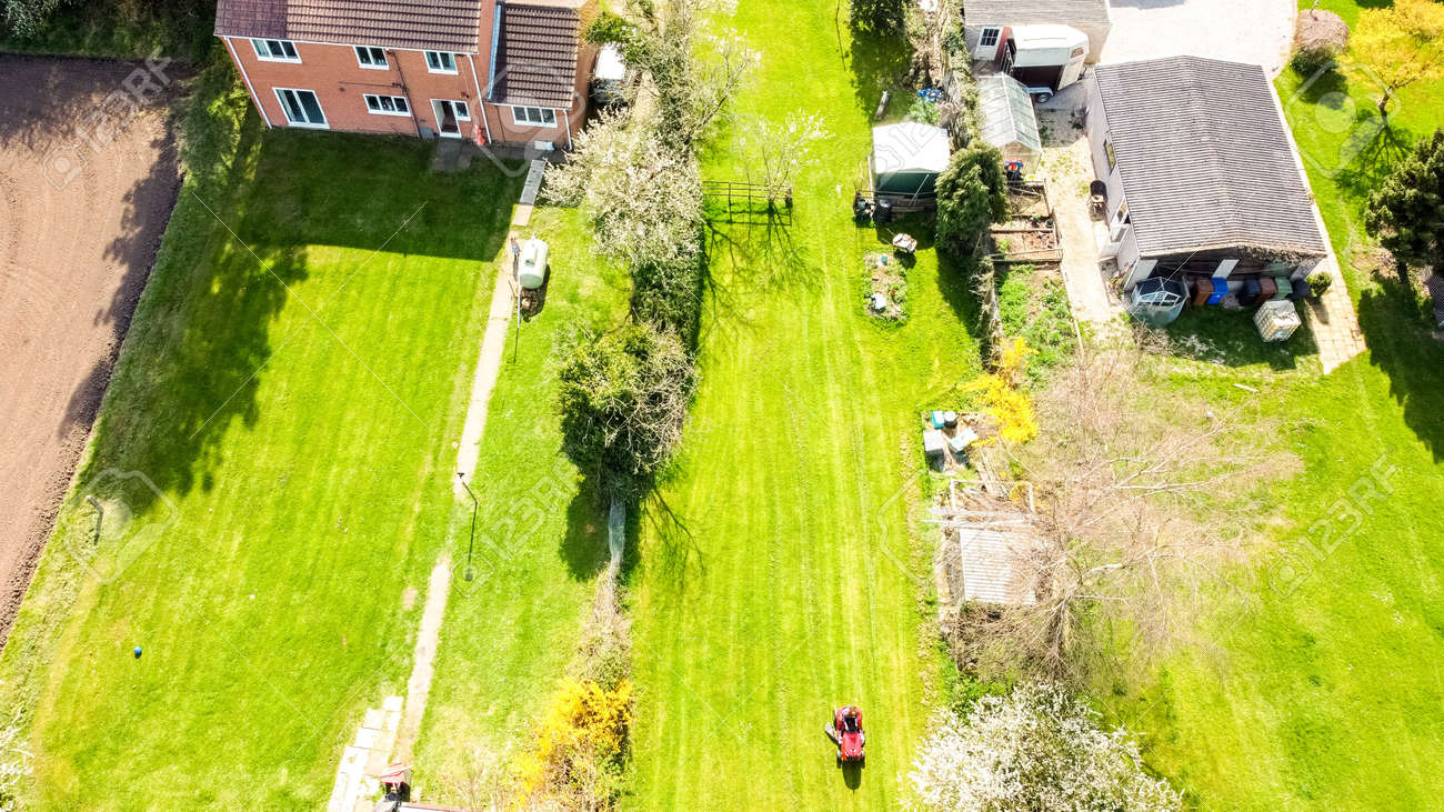 A long garden at the rear of a small property, in England, United Kingdom. The view seen from a drone high up above the property. - 168149671 A long garden at the rear of a small property, in England, United Kingdom. The view seen from a drone high up above the property. - 168149671