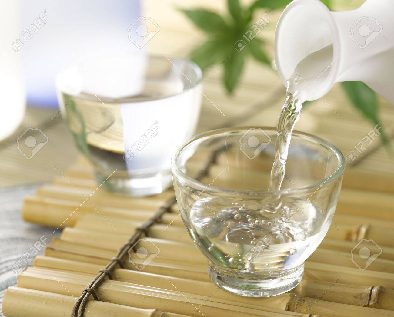 A Cup Of Japanese Sake Pouring From The Sake Decanter Stock Photo Picture And Royalty Free Image Image