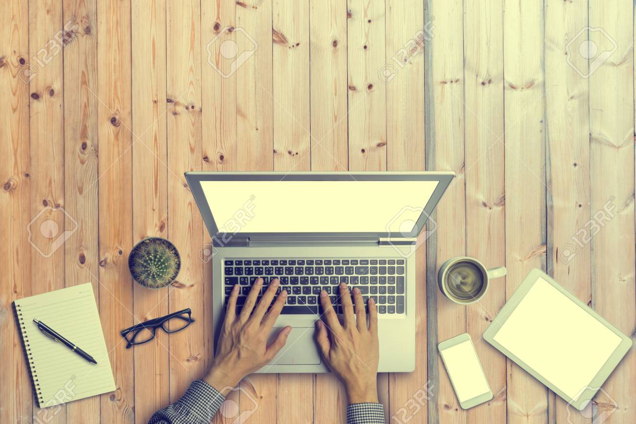 Top View Of Business People Hands Working With A Laptop On Old
