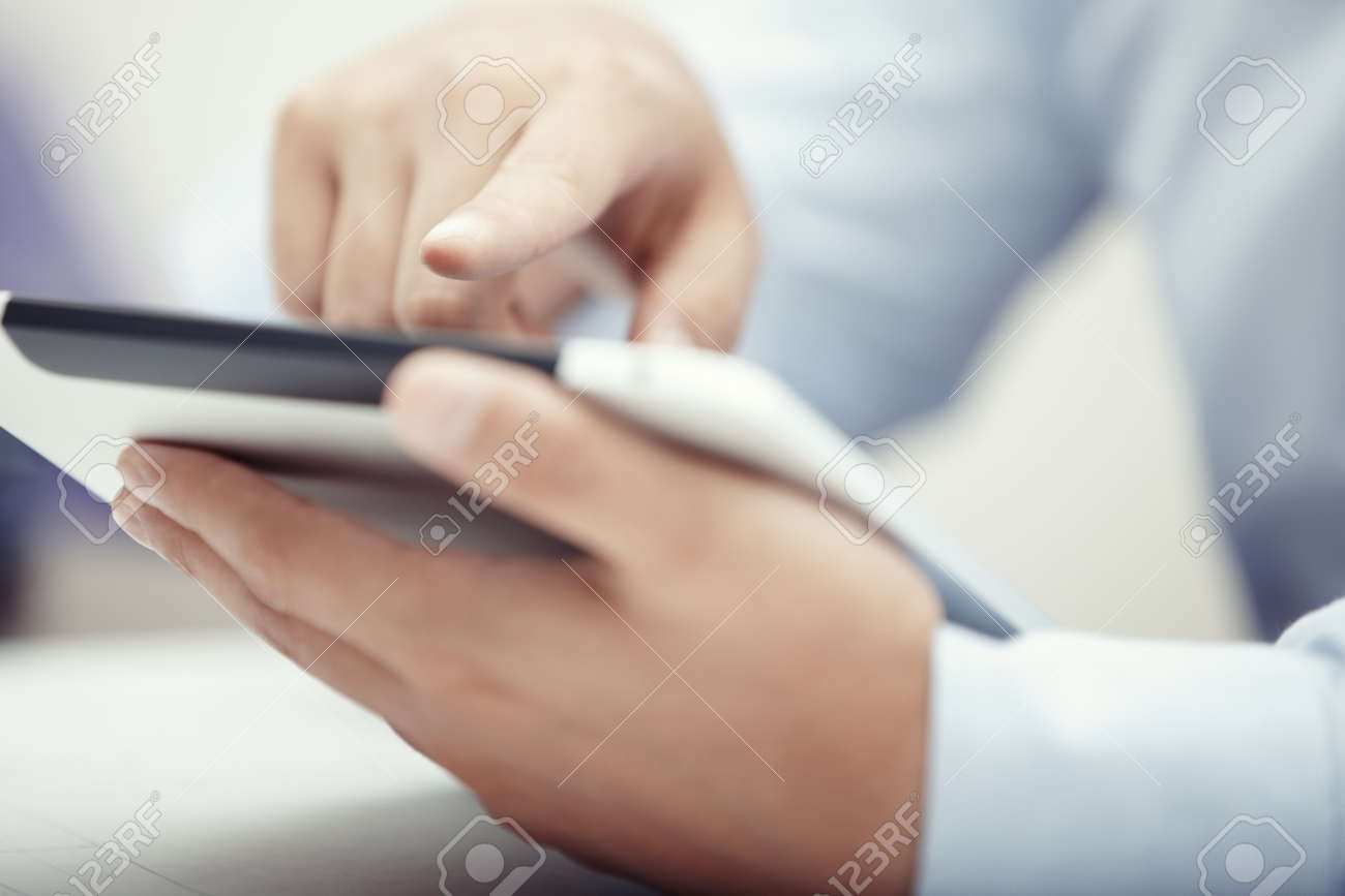 Hands of businessman using tablet PC at office - 14276862 Hands of businessman using tablet PC at office - 14276862