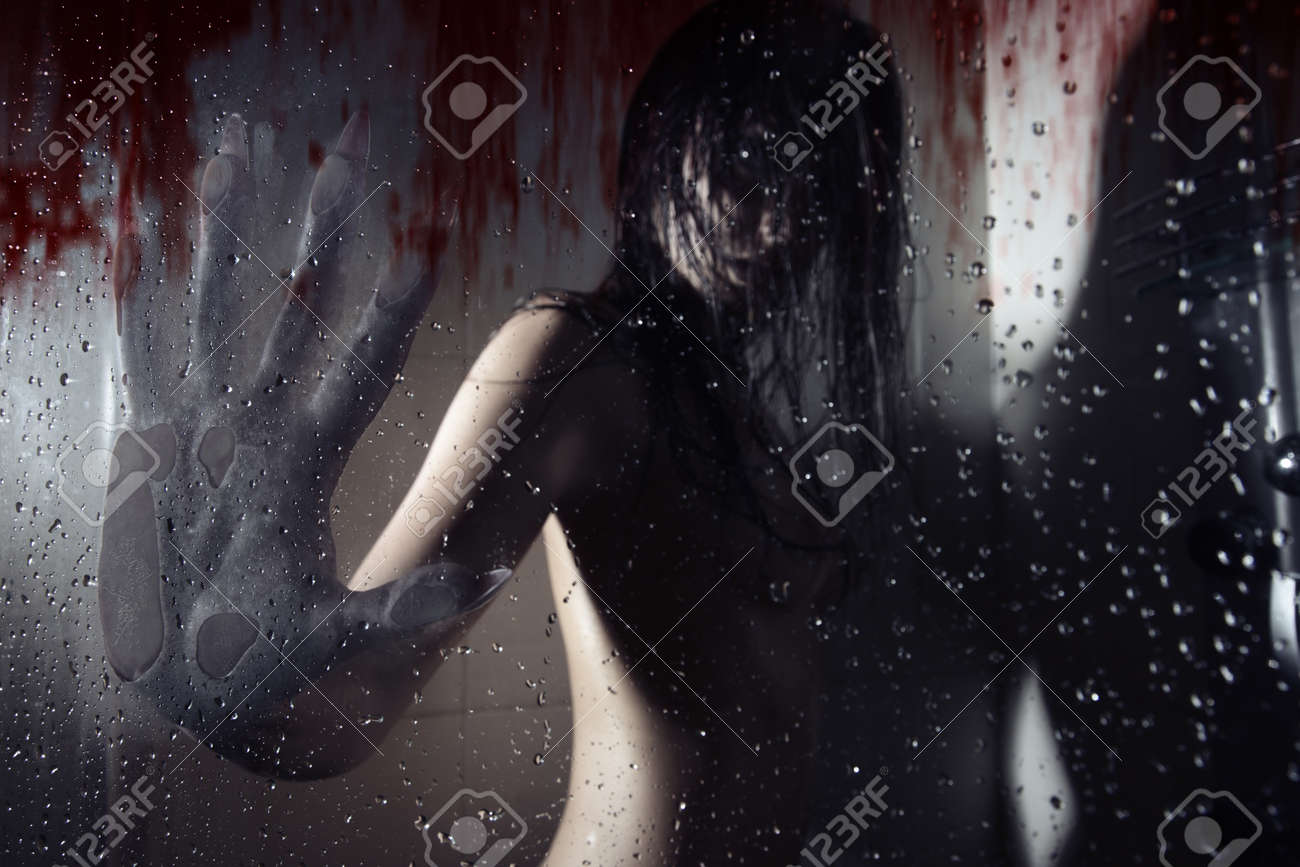 Werewolf in the dark bathroom touching wet bloody glass by his huge hand with sharp nails. Natural darkness. Artistic colors and grain added - 15058680 Werewolf in the dark bathroom touching wet bloody glass by his huge hand with sharp nails. Natural darkness. Artistic colors and grain added - 15058680