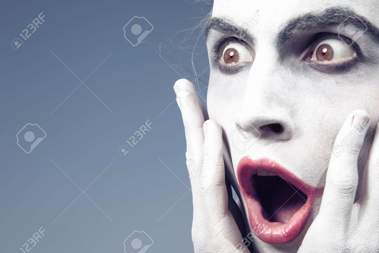Man with white makeup expressing shock - 15408323 Man with white makeup expressing shock - 15408323