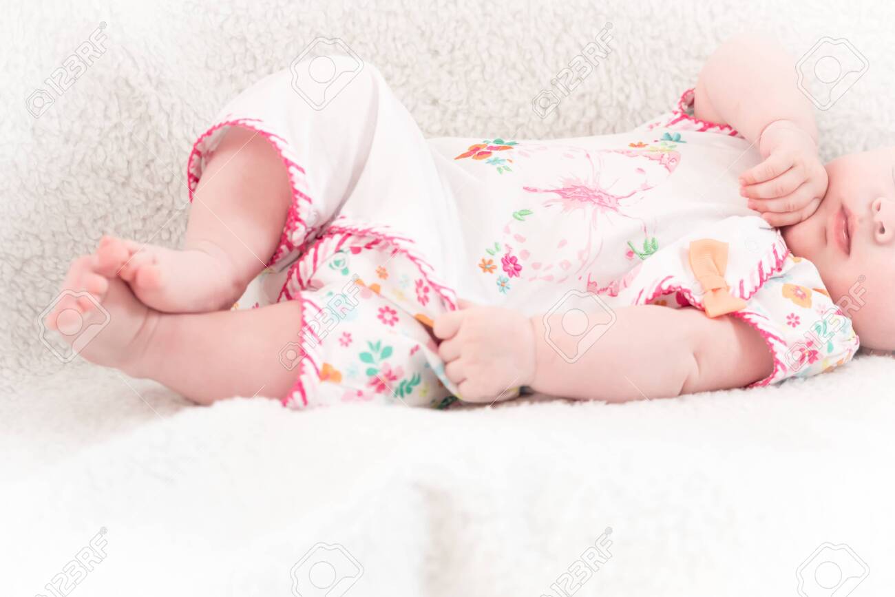 New-born baby lying in the bed - 147967883 New-born baby lying in the bed - 147967883