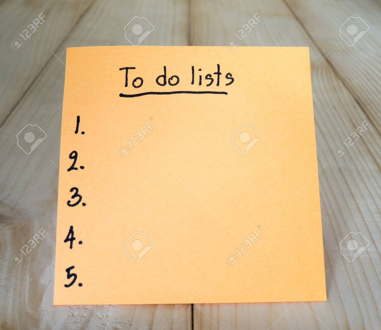 to do list on colorful sticky note with wood background stock photo