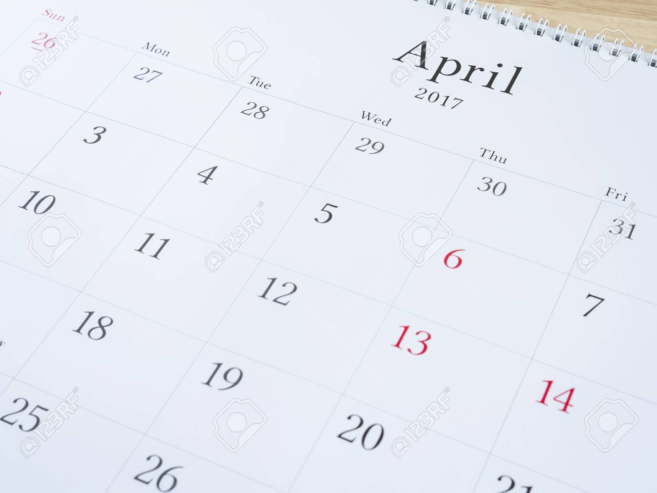 april on white calendar page desk calendar on wood background april calendar page