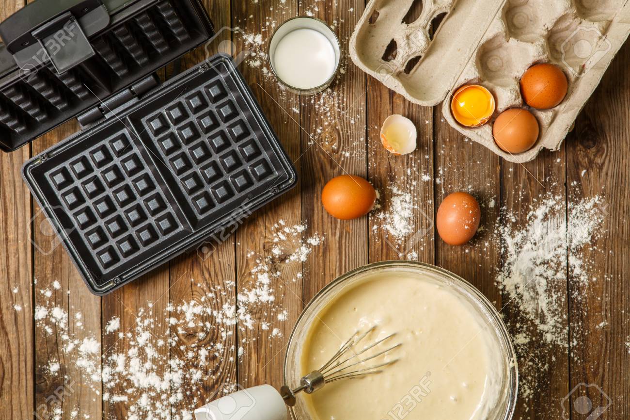 Making Waffles At Home Waffle Iron Batter In Bowl And Ingredients - 
