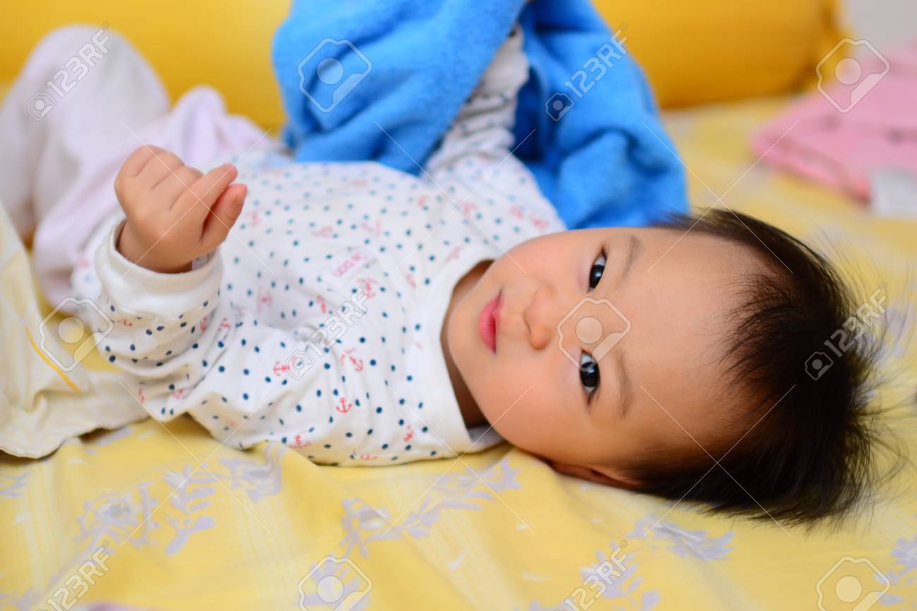 A shot of a cute asian baby girl - 13258601 A shot of a cute asian baby girl - 13258601