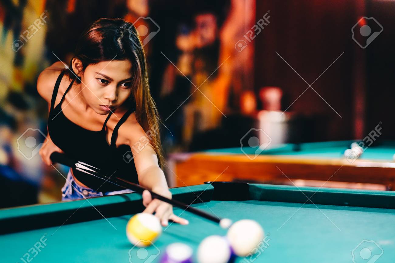 Beautiful Girl Playing Billiard In A 