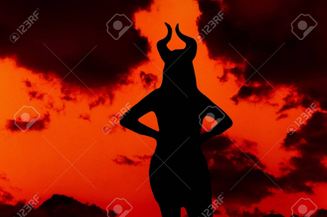 Horned Devil Woman On A Background Of Black Clouds And Sky Fiery Red. Stock  Photo, Picture and Royalty Free Image. Image 139409149., image size:1300x866