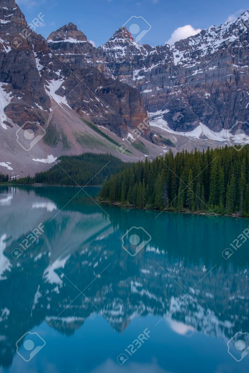 Vertical of The Moraine lake sunset with turquoise lake and bluesky, Banff, Alberta, Canada - 115023903 Vertical of The Moraine lake sunset with turquoise lake and bluesky, Banff, Alberta, Canada - 115023903