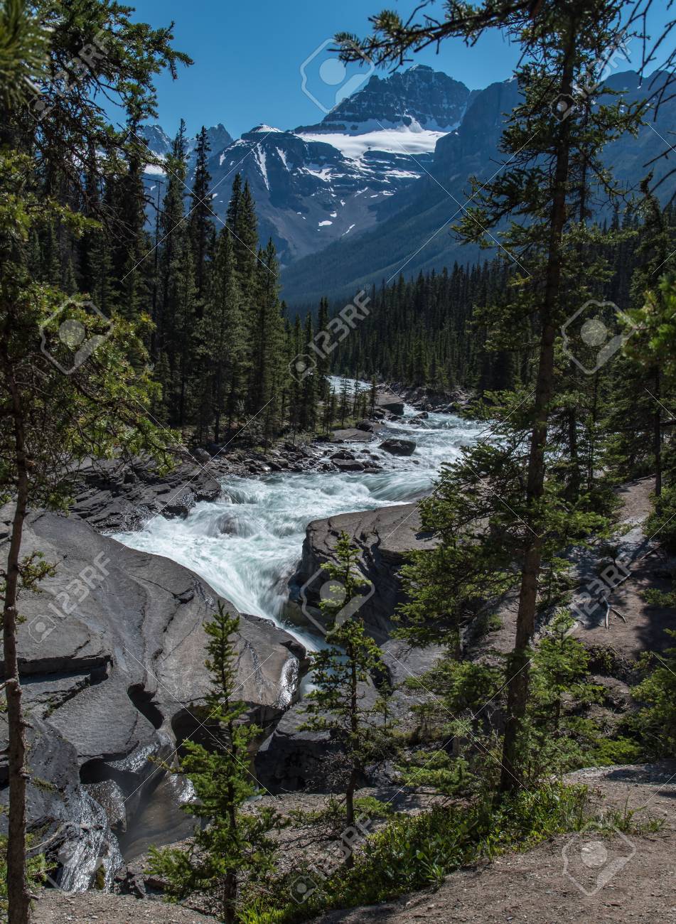 Mistaya canyon in summer beautiful blue sky in sunny day with mountain and river flowing , Alberta, Canada - 115023909 Mistaya canyon in summer beautiful blue sky in sunny day with mountain and river flowing , Alberta, Canada - 115023909