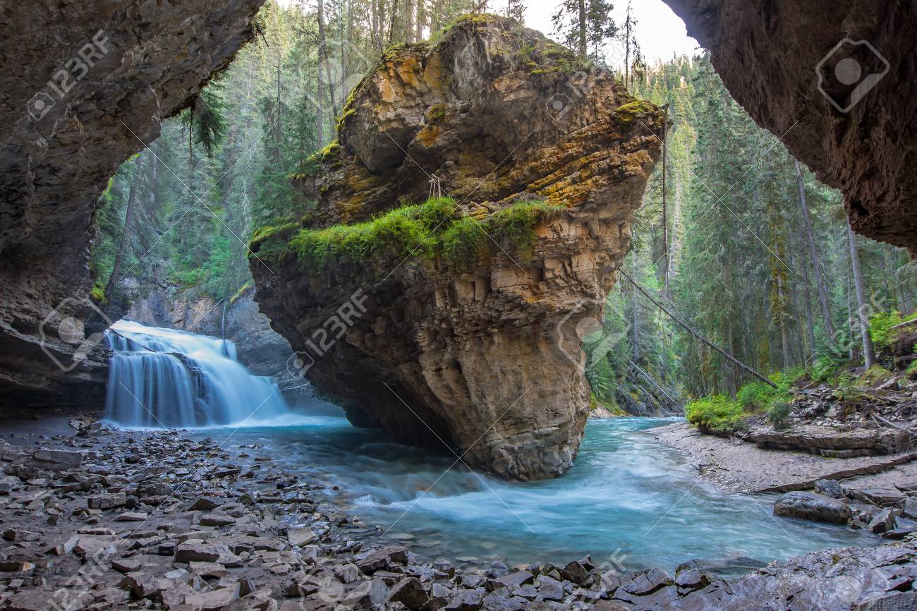 Johnston Canyon cave in Spring season with waterfalls, Johnston Canyon Trail, Alberta, Canada. - 115343565 Johnston Canyon cave in Spring season with waterfalls, Johnston Canyon Trail, Alberta, Canada. - 115343565
