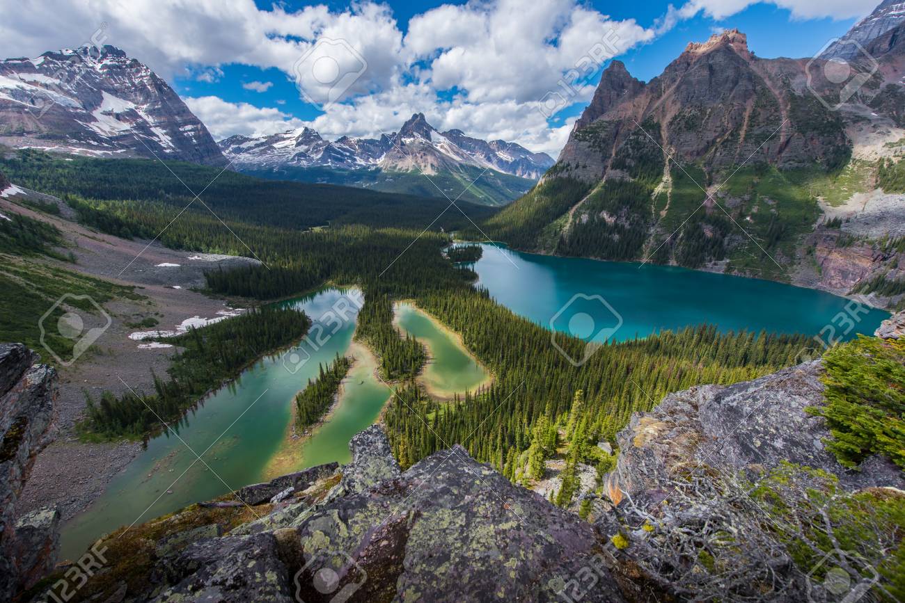Opabin lake beautiful hiking trail in cloudy day in Spring, Yoho, Canada. - 115343600 Opabin lake beautiful hiking trail in cloudy day in Spring, Yoho, Canada. - 115343600