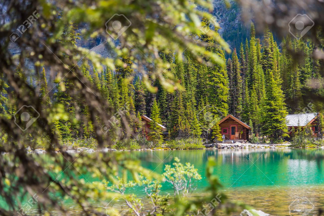Cottages at Lake Ohara hiking trail in sunny day in Spring, Yoho, Canada. - 115503219 Cottages at Lake Ohara hiking trail in sunny day in Spring, Yoho, Canada. - 115503219