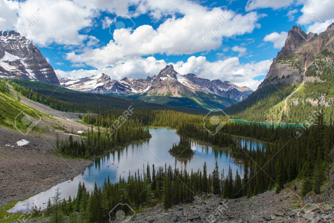 Opabin lake beautiful hiking trail in cloudy day in Spring, Yoho, Canada. - 115503220 Opabin lake beautiful hiking trail in cloudy day in Spring, Yoho, Canada. - 115503220
