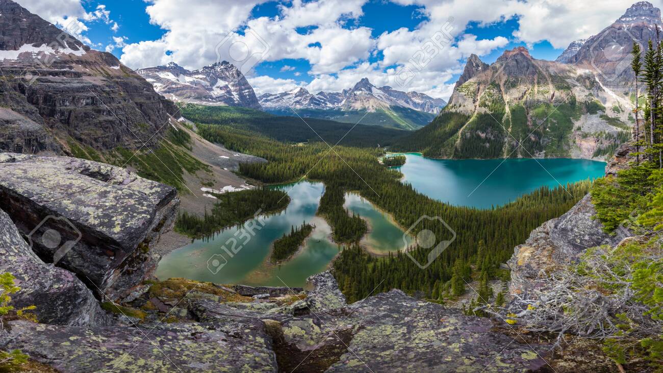 Opabin lake beautiful hiking trail in cloudy day in Spring, Yoho, Canada. - 115503222 Opabin lake beautiful hiking trail in cloudy day in Spring, Yoho, Canada. - 115503222