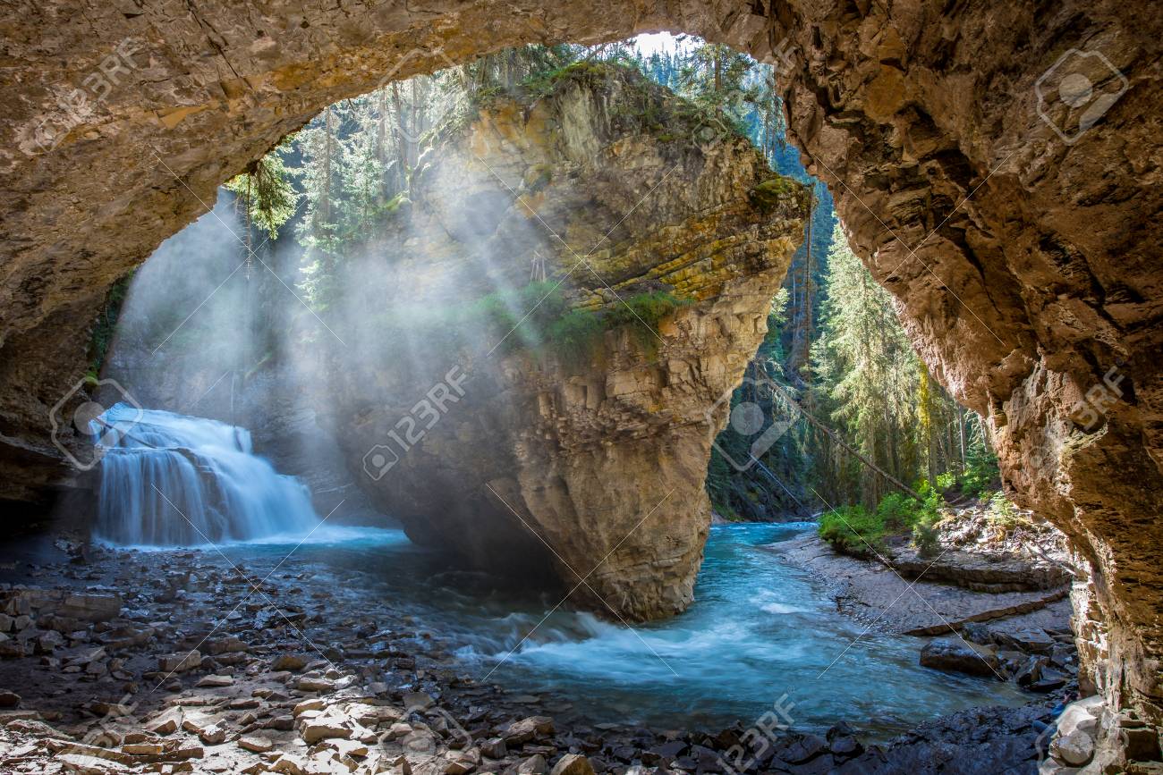 Johnston Canyon cave in Spring season with waterfalls, Johnston Canyon Trail, Alberta, Canada. - 115503228 Johnston Canyon cave in Spring season with waterfalls, Johnston Canyon Trail, Alberta, Canada. - 115503228