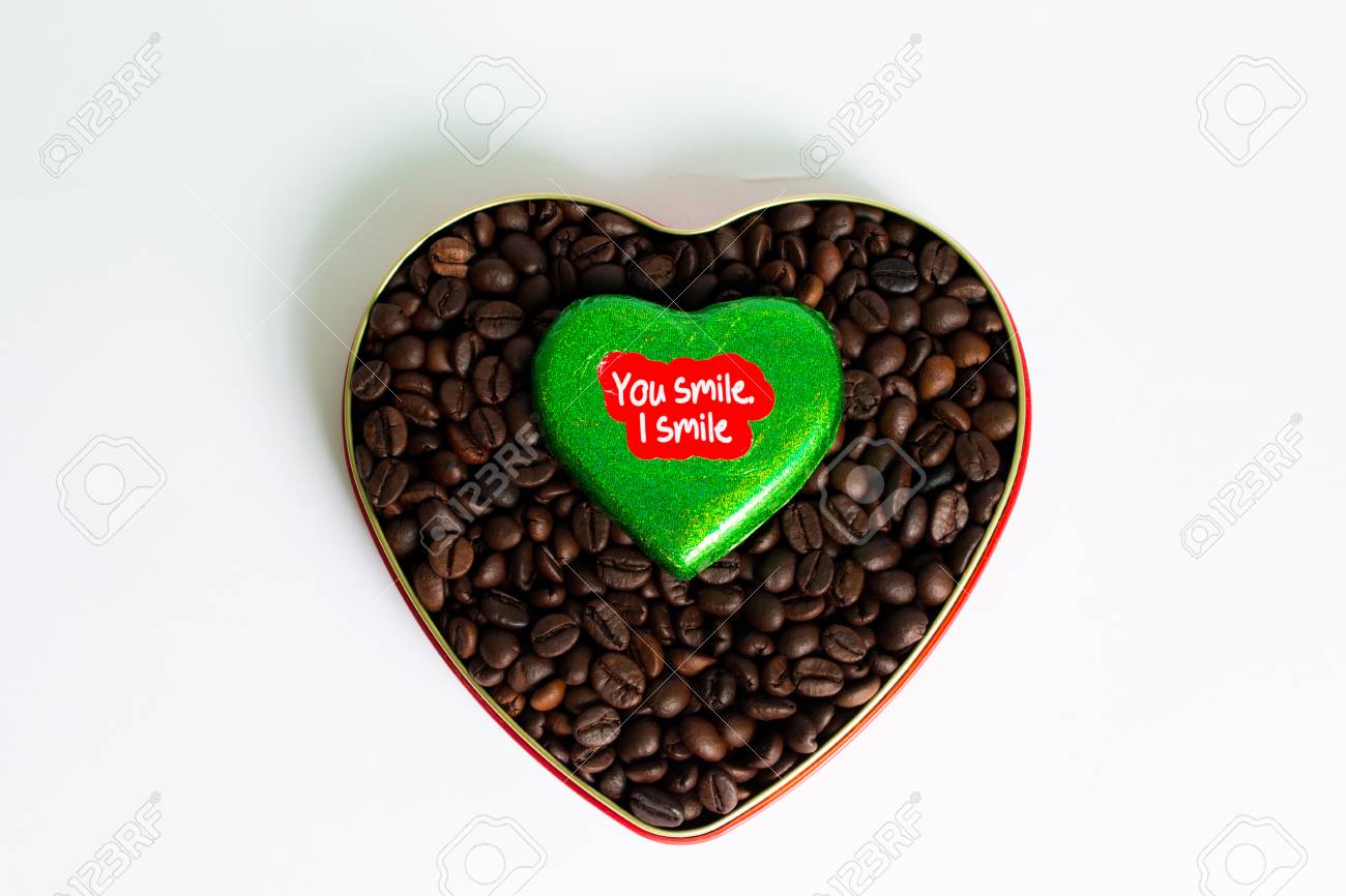 coffee beans surrounded chocolate wrapper on valentines day chocalate wrapper