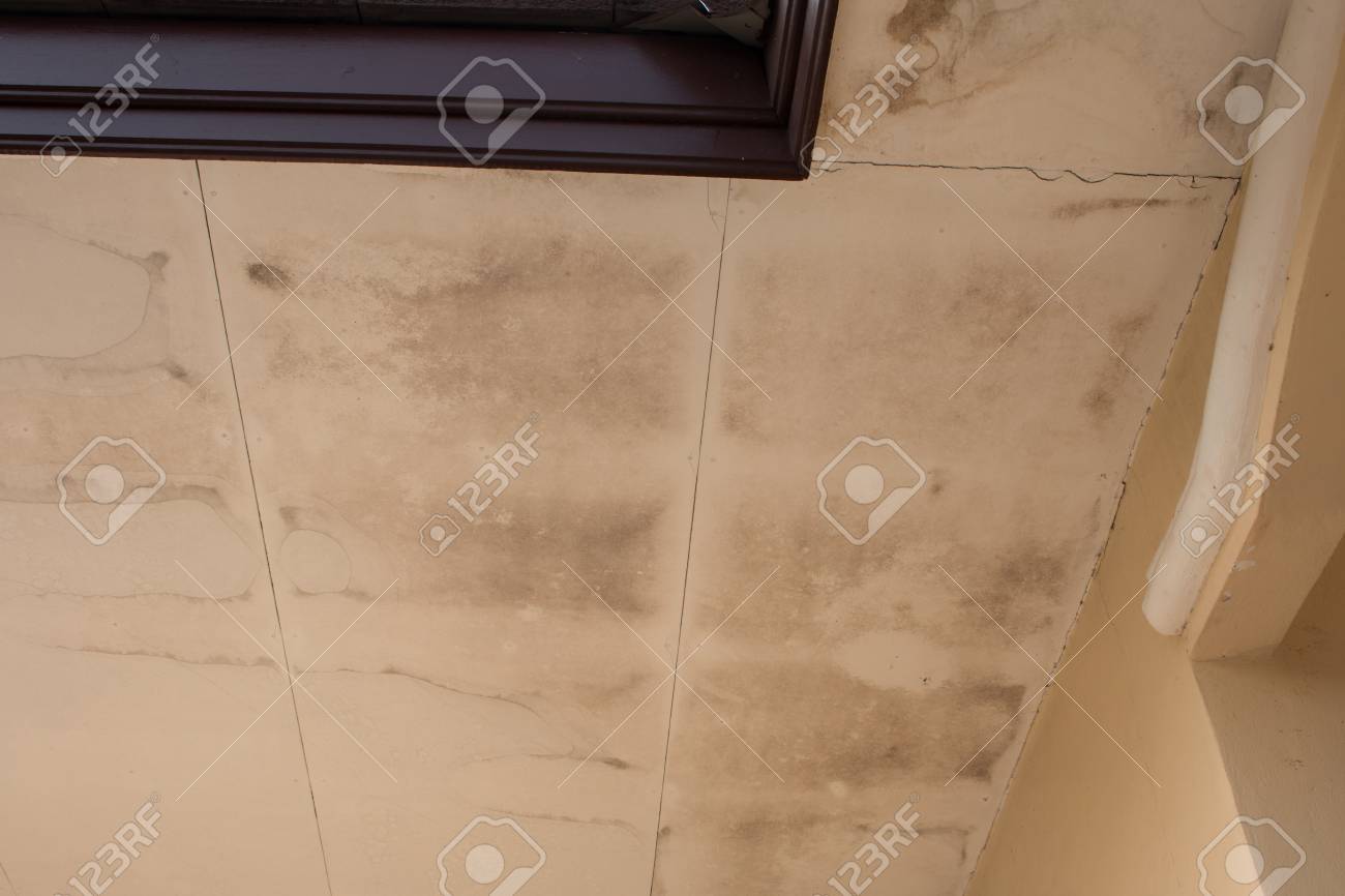 Water Damaged Ceiling In An Old Abandoned House Stock Photo