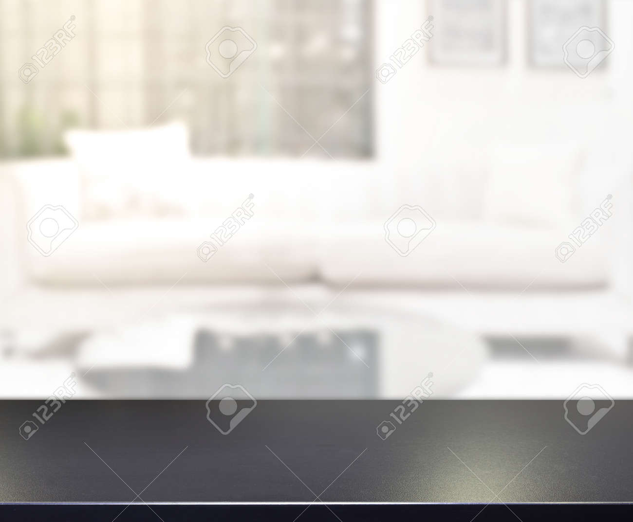 Table Top And Blur Living Room Of The Background - 148705463 Table Top And Blur Living Room Of The Background - 148705463