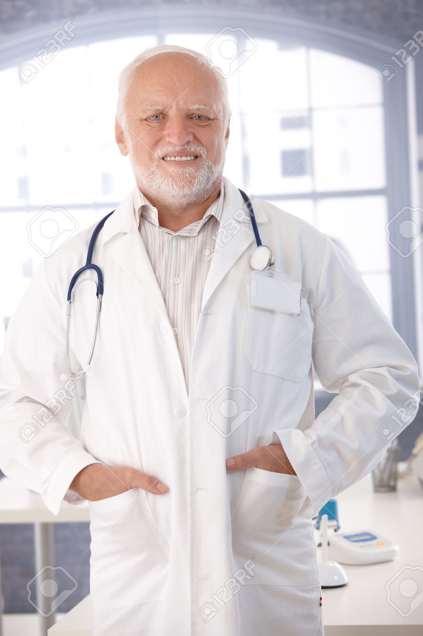 Mature Doctor Smiling In Lab Coat In His Room. Stock Photo, Picture and  Royalty Free Image. Image 10373356.