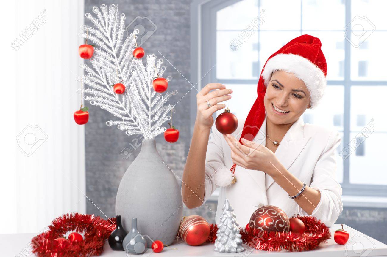 Woman Home Decorating happy woman getting ready for christmas, decorating home, wearing Woman Home Decorating happy woman getting ready for christmas, decorating home, wearing