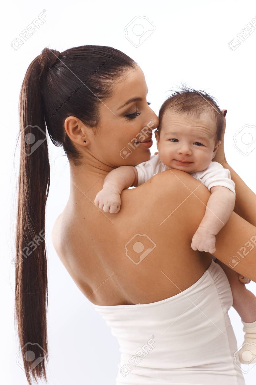Young Mother Holding Smiling Baby In Arm. Stock Photo, Picture and Royalty  Free Image. Image 17159651., image size:866x1300