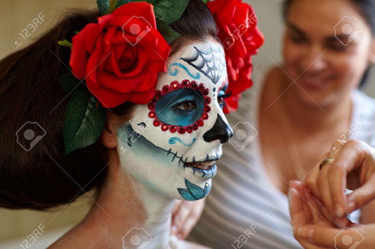 makeup artists in work making a halloween makeup mexican santa muerte mask stock photo - Mexican Halloween Mask makeup artists in work making a halloween makeup mexican santa muerte mask stock photo - Mexican Halloween Mask