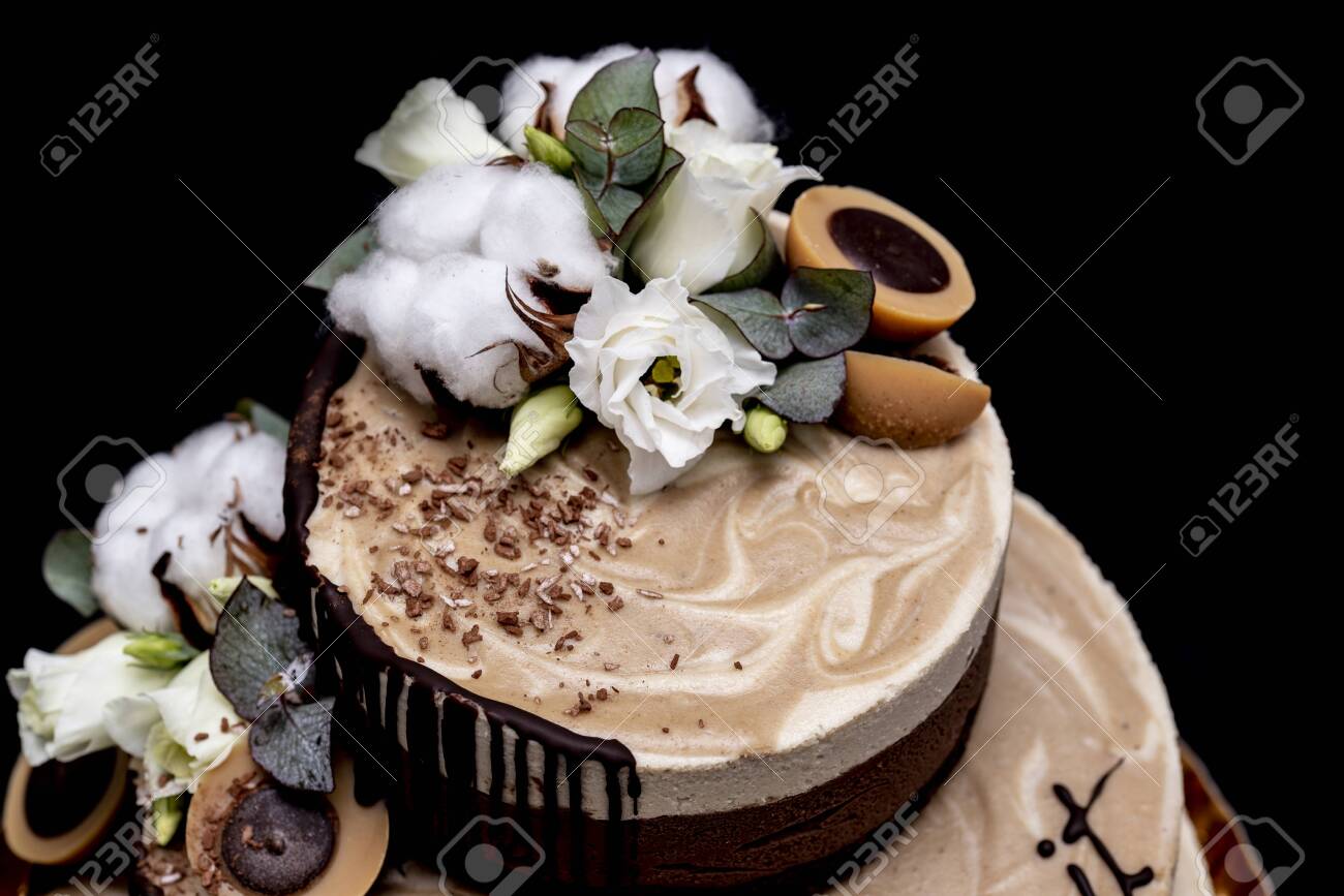 Raw Vegan Cake With Chocolate Vanilla And Peanut Butter Decorated With Cotton Flowers And Candy Raw Vegan Toffee Stock Photo Picture And Royalty Free Image Image