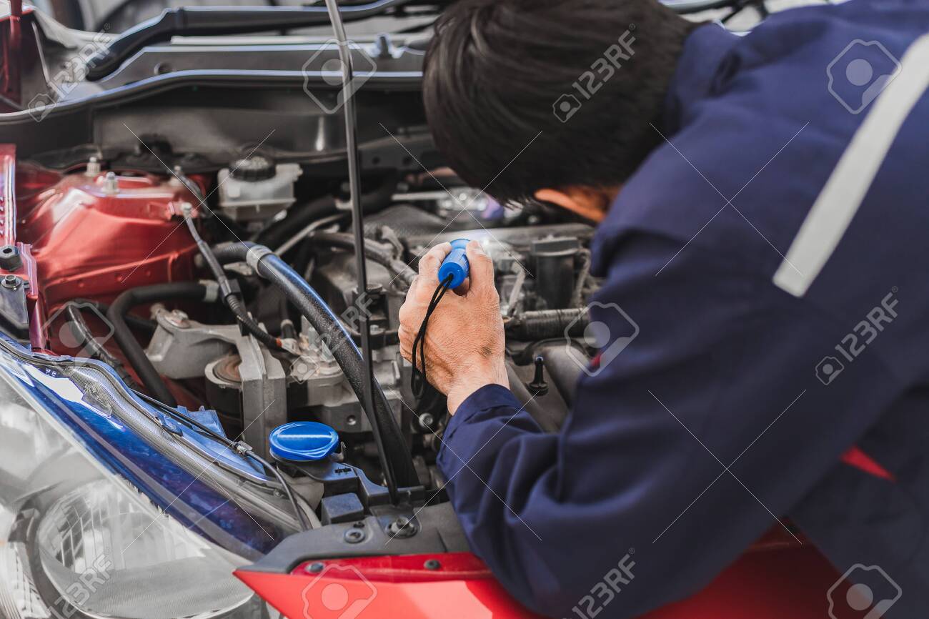 Asian Man mechanic inspection Shine a torch car engine checking bug in engine from application smartphone.Red car for service maintenance insurance with car engine.for transport automobile automotive - 150549432 Asian Man mechanic inspection Shine a torch car engine checking bug in engine from application smartphone.Red car for service maintenance insurance with car engine.for transport automobile automotive - 150549432