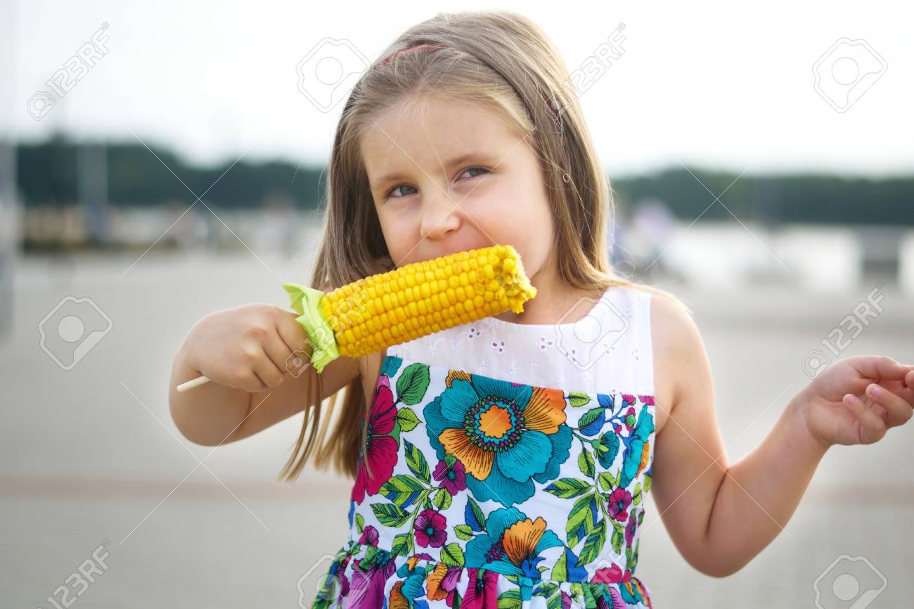 Adorable Funny Girl Eating Corn On The Cob Stock Photo, Picture And Royalty Free Image. Image 64978731. Adorable Funny Girl Eating Corn On The Cob Stock Photo, Picture And Royalty Free Image. Image 64978731.
