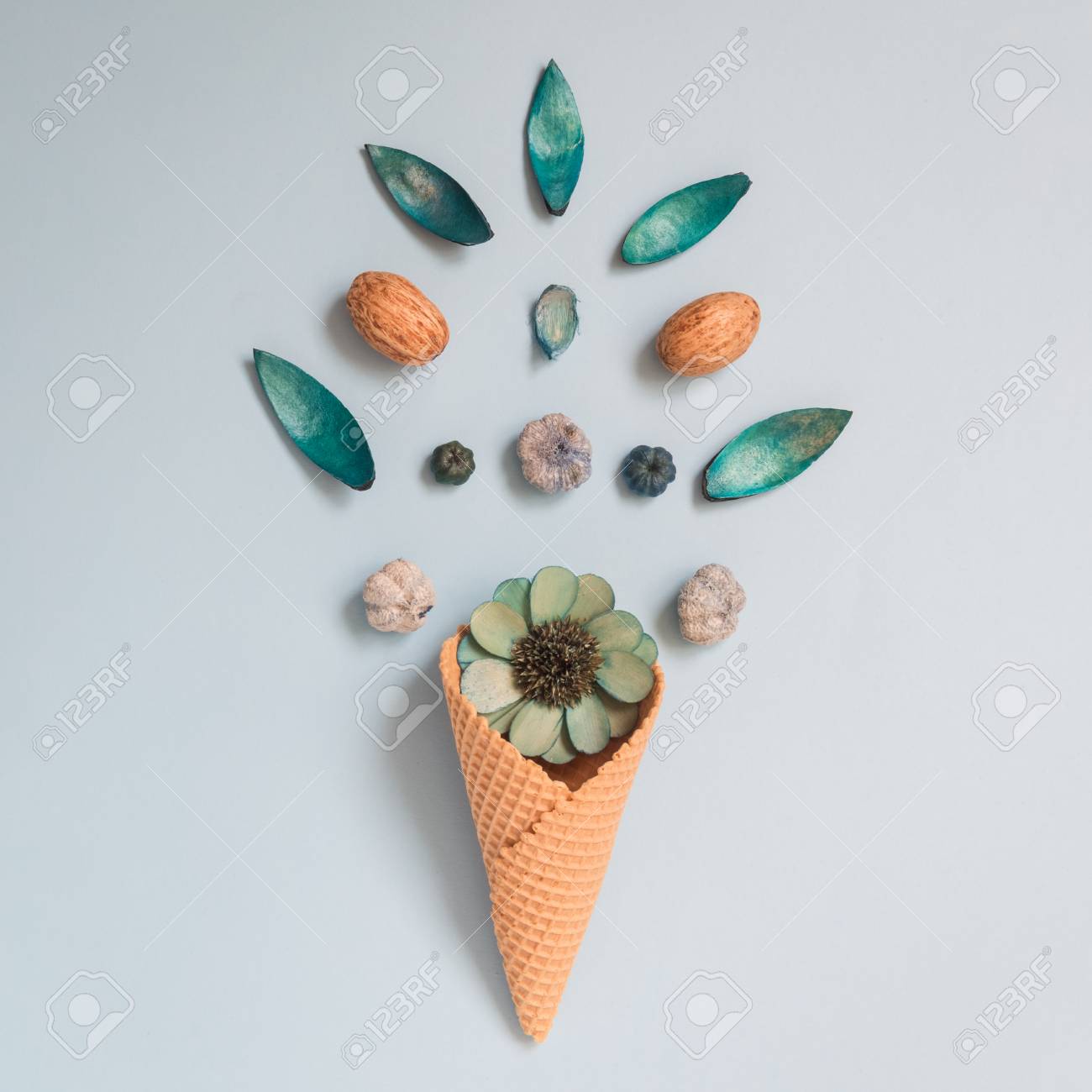 Ice Cream Cone With Dried Flowers Flat Lay On Pastel Blue Background