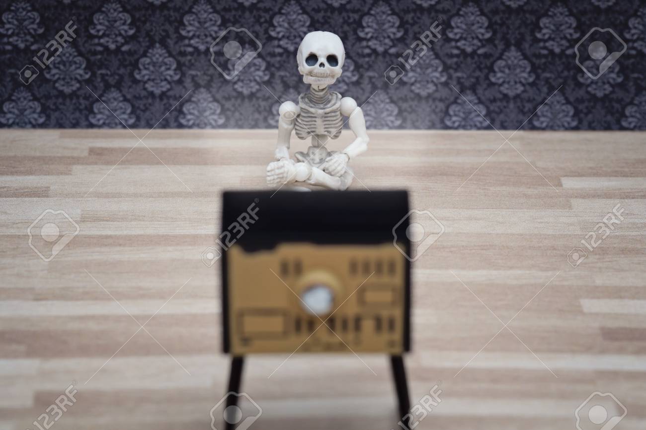 Little Skeleton Sitting Close To The Tv And Watching Stock Photo Picture And Royalty Free Image Image