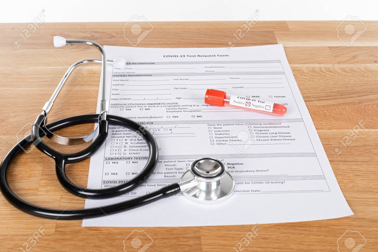 Close up picture of covid-19 blood test and medical supplies, pills on wooden background - 146210747 Close up picture of covid-19 blood test and medical supplies, pills on wooden background - 146210747