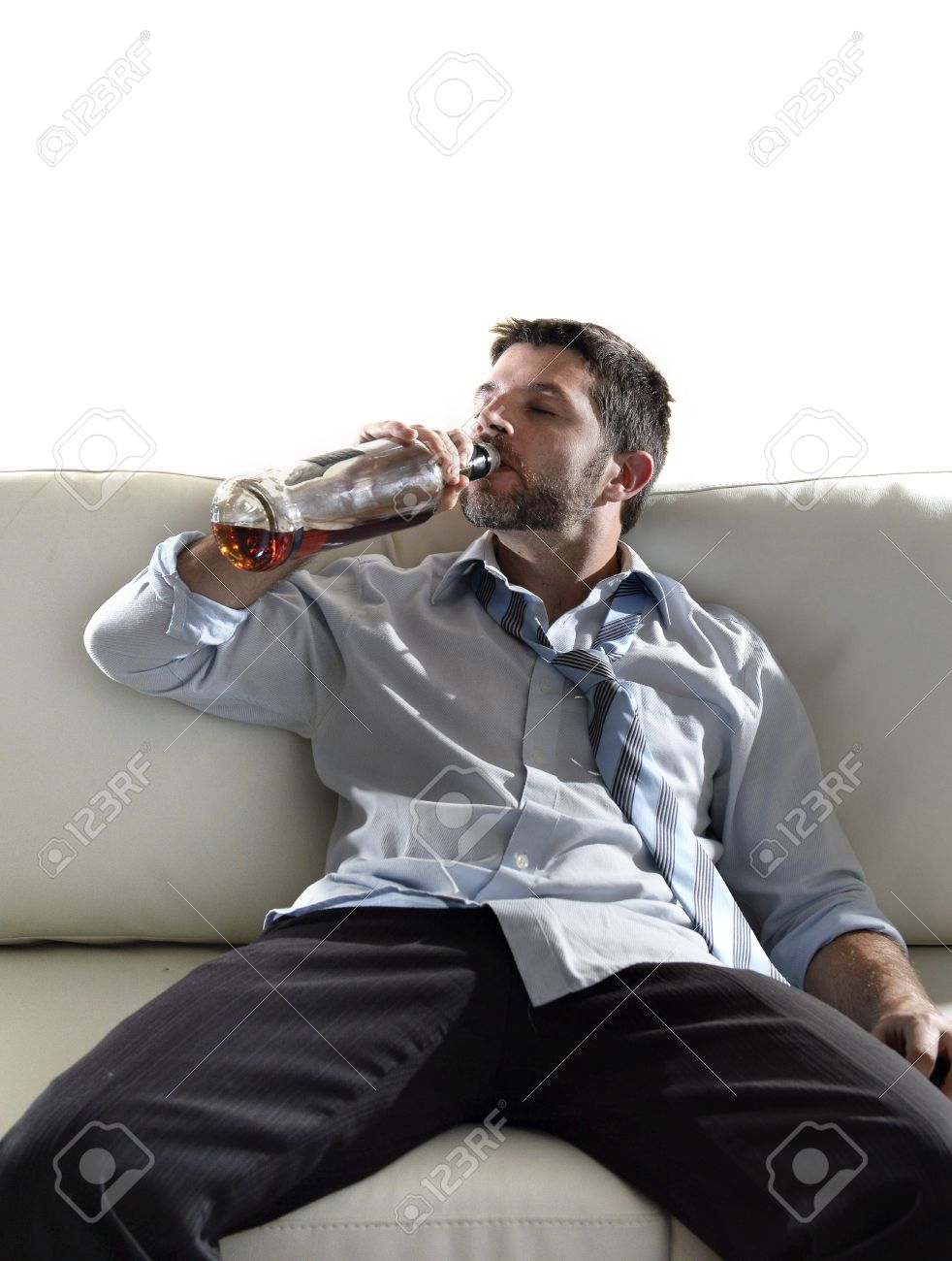 Attractive Drunk Business Man Sitting On Couch Wasted Drinking Stock Photo Picture And Royalty Free Image Image 30675123