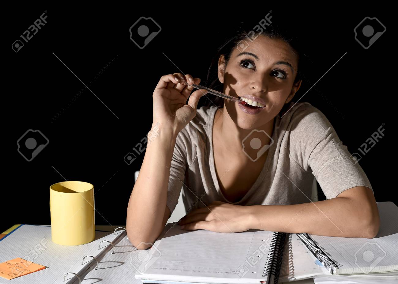Young Beautiful Spanish Girl Studying Tired And Bored At Home ... Young Beautiful Spanish Girl Studying Tired And Bored At Home ...
