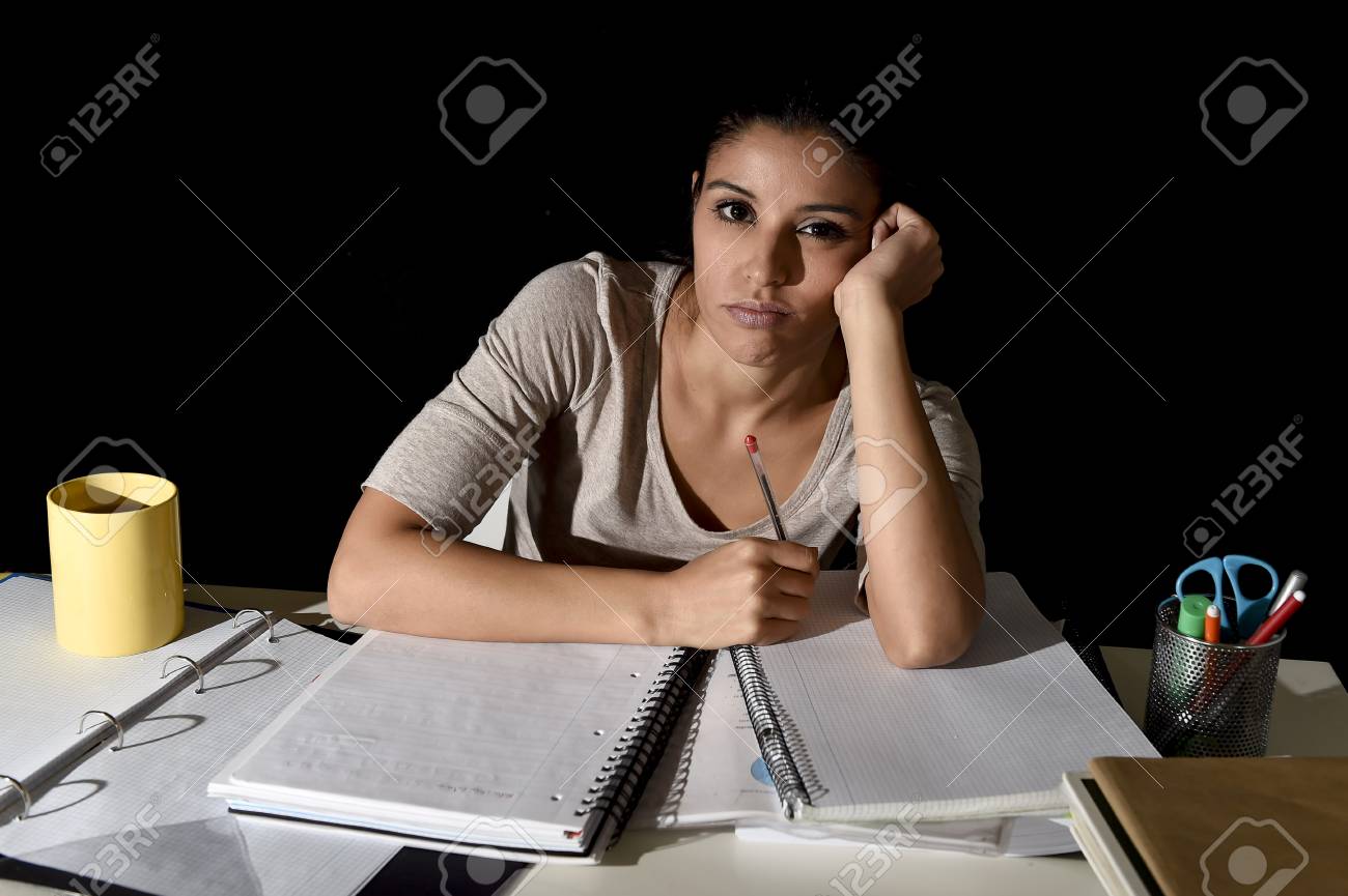 Young Beautiful Spanish Girl Studying Tired And Bored At Home ... Young Beautiful Spanish Girl Studying Tired And Bored At Home ...