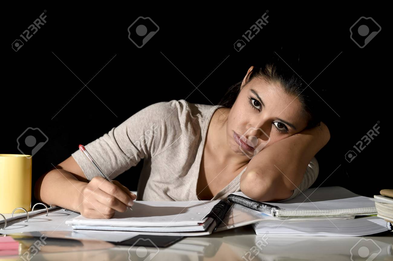 Young Beautiful Spanish Girl Studying Tired And Bored At Home ... Young Beautiful Spanish Girl Studying Tired And Bored At Home ...