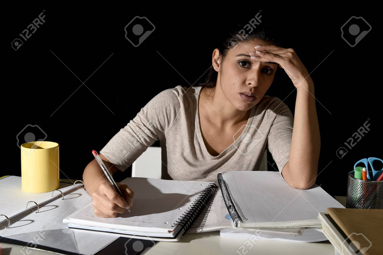 Young Beautiful Spanish Girl Studying Tired And Bored At Home ... Young Beautiful Spanish Girl Studying Tired And Bored At Home ...