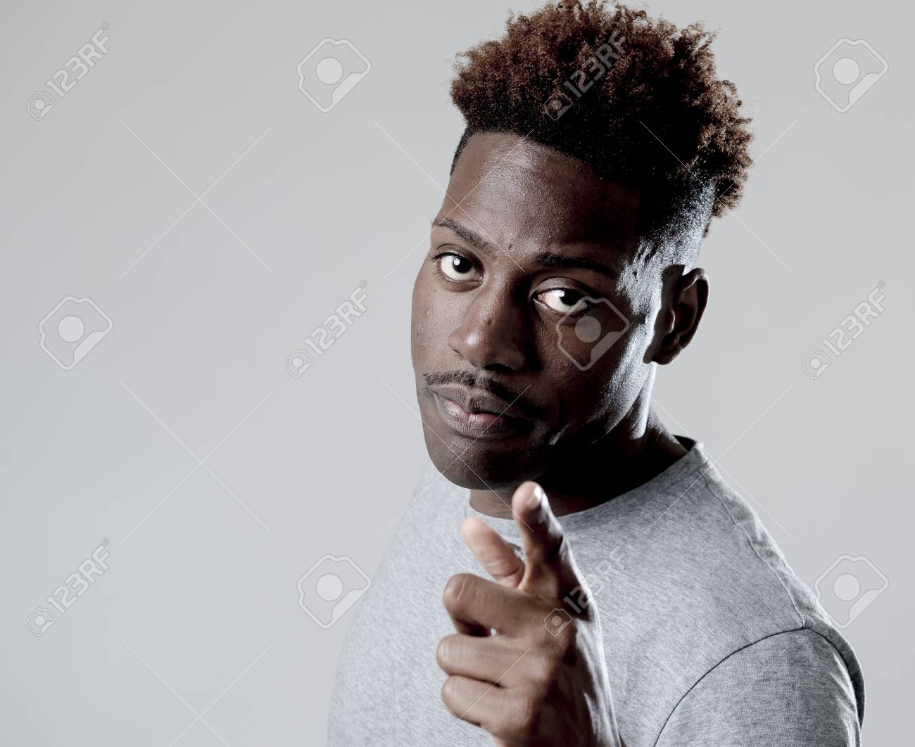 Young Attractive African American Black Man In Rage Threaten Punching With  Fist In Angry Upset And Mad Face Expression Isolated Grey Background In  Violence And Aggression Concept Stock Photo, Picture And Royalty