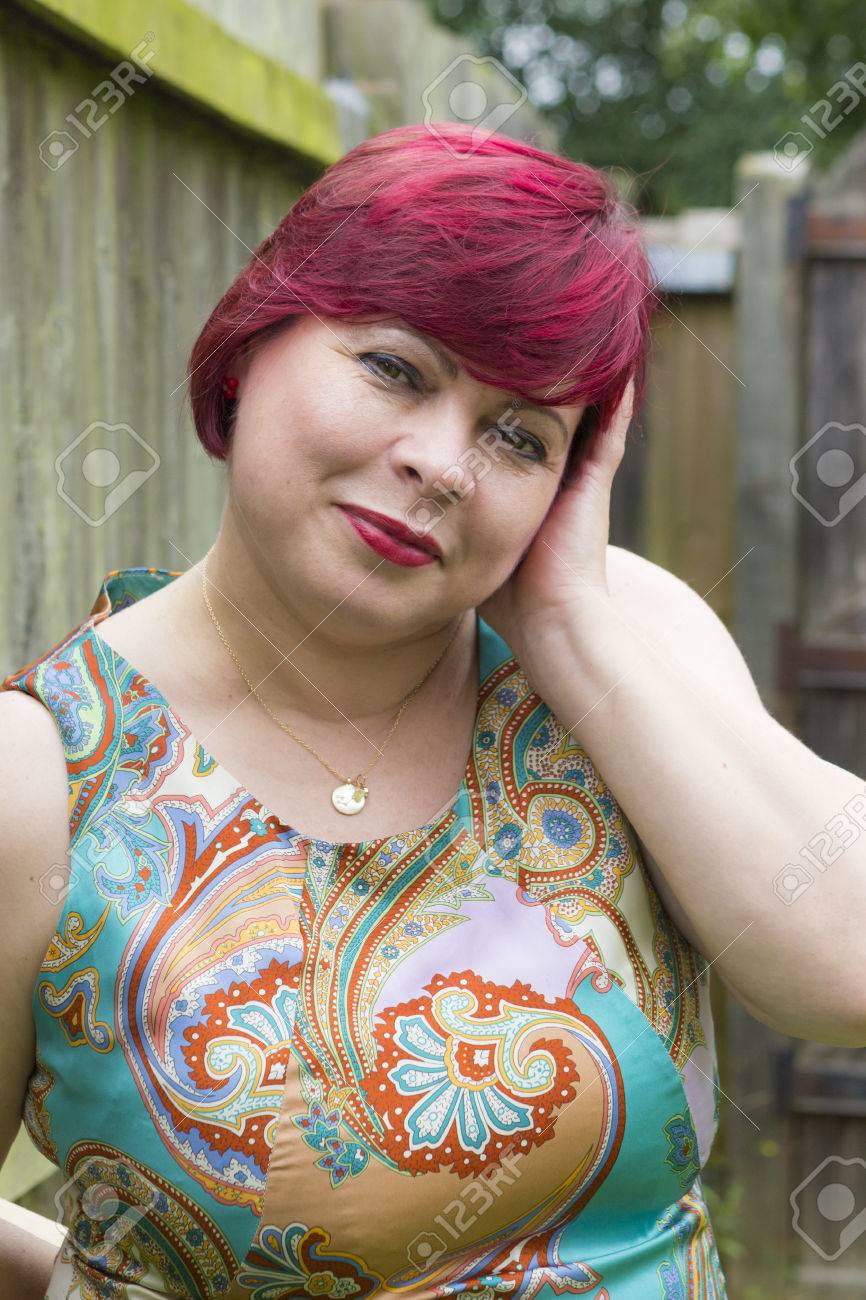 Woman With Red Hair Outdoors In Summertime Stock Photo, Picture And Royalty Free Image 61364298.