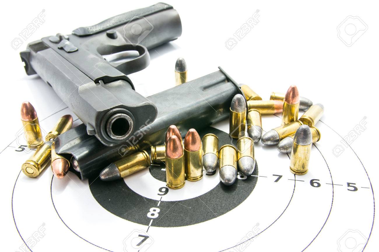 Gun and Bullets on shooting range Isolated on the white background. - 82508011 Gun and Bullets on shooting range Isolated on the white background. - 82508011