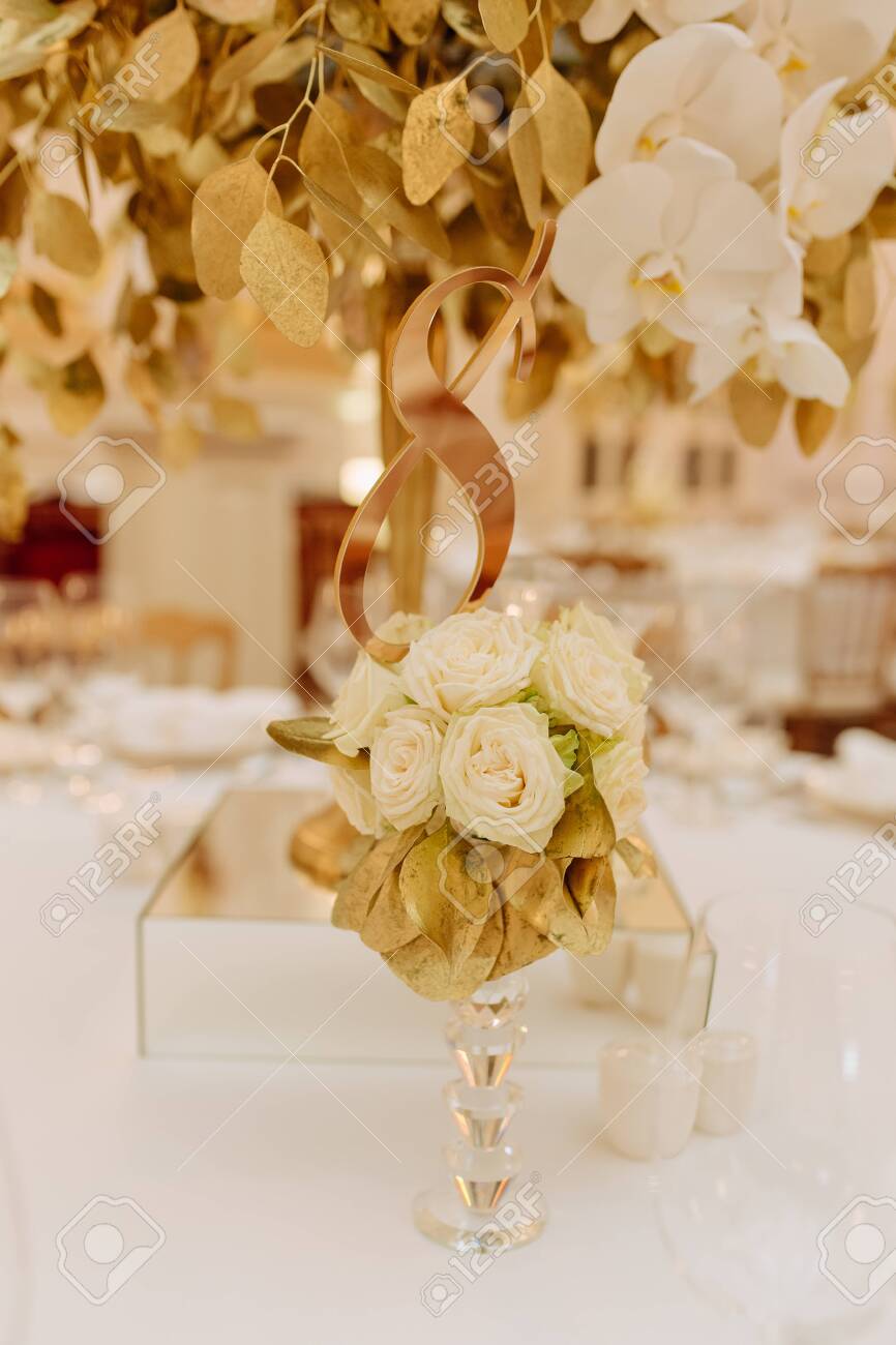 Decorative Bouquet Souvenir On Crystal Stem Photo Elegance Floral Ornament Made From White Rose Buds Golden Leaves Standing On Dinner Table Luxury And Aromatic Decor Blurred Background Stock Photo Picture And Royalty