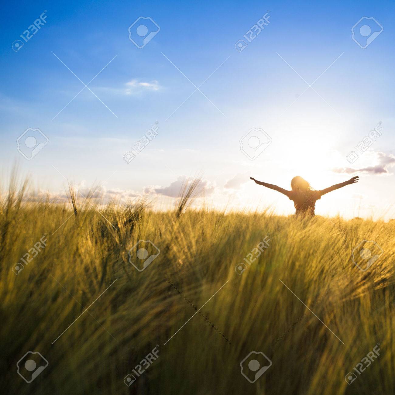 Teenage girl enjoy with sunshine in wheat field - 42340565 Teenage girl enjoy with sunshine in wheat field - 42340565